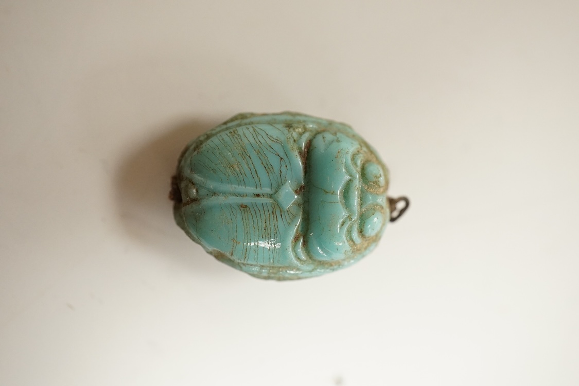 A Chinese carved rock crystal lion, a turquoise bead and a small quantity of marbles, lion 8.5cm wide